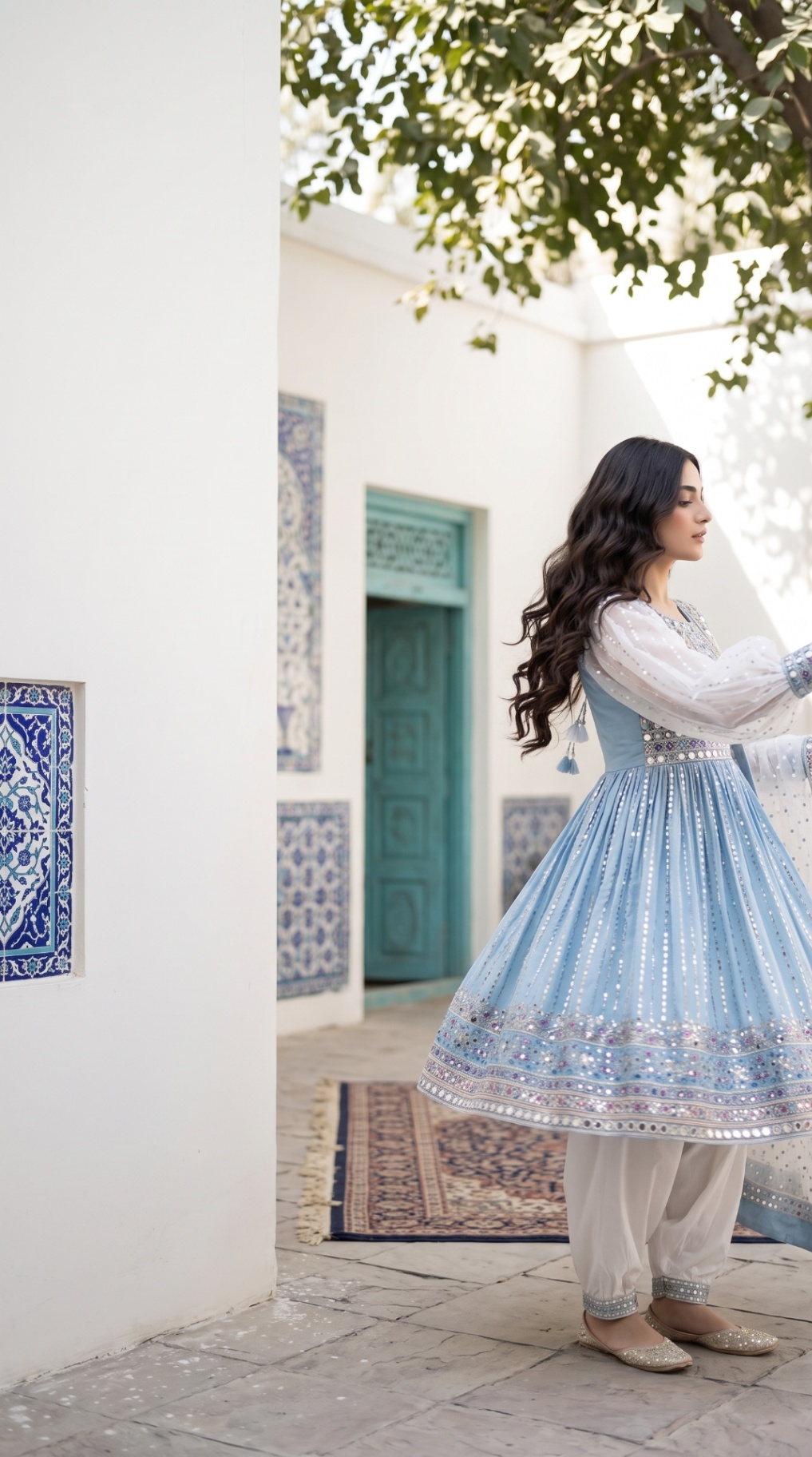 Sitara in an Afghan courtyard with blue tilework and a turquoise door